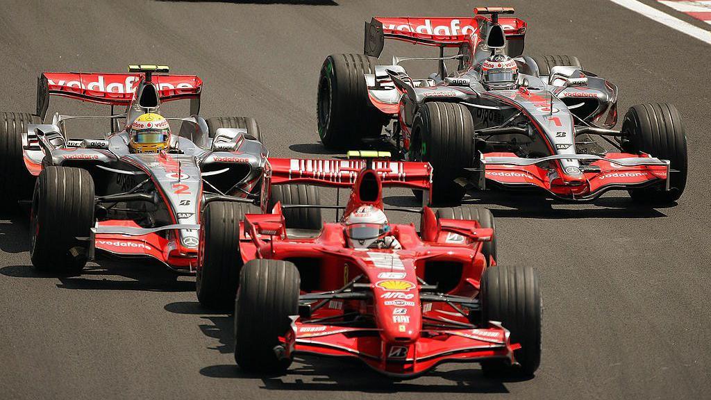 Kimi Raikkonen's Ferrari ahead of Lewis Hamilton and Fernando Alonso in the McLaren cars
