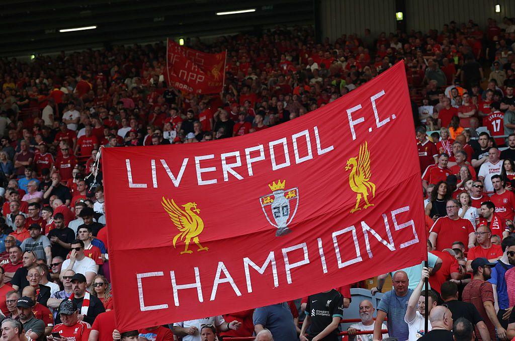 A flag saying Liverpool Champions at their Anfield stadium.