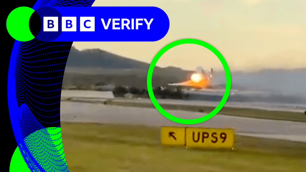 A screengrab of a plane taking off with an engine on fire on its wing