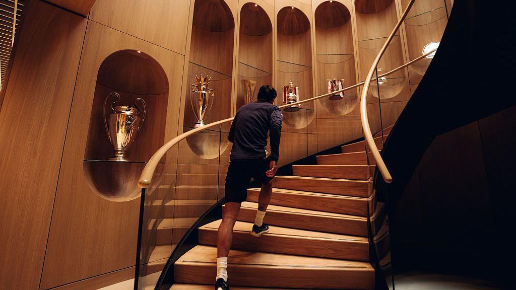 Manchester United's trophies line the stairs 