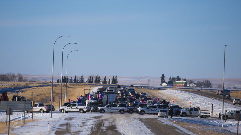 Protesters attempting to reach the U.S.-Canada border at a police blockade 15 miles north of Coutts, Alberta, Canada, on Wednesday, Feb 2, 2022.