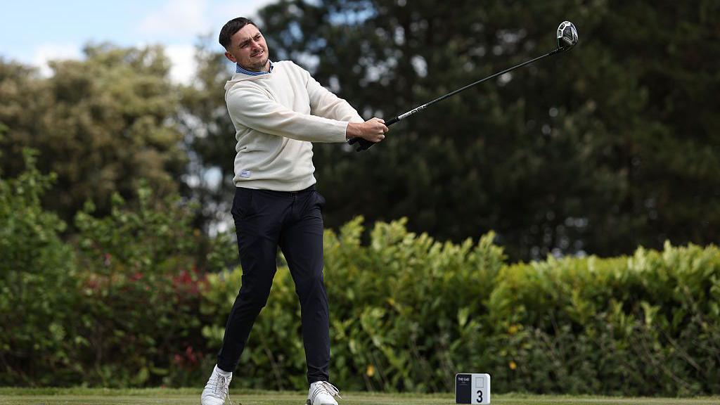 Dylan Baines playing a shot at Celtic Manor 