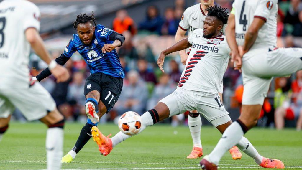 Ademola Lookman shoots from distance to score his second goal against Bayer Leverkusen