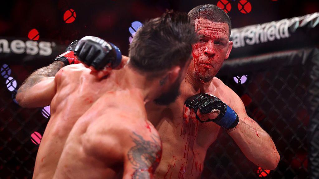 Blood pours from Nate Diaz's face