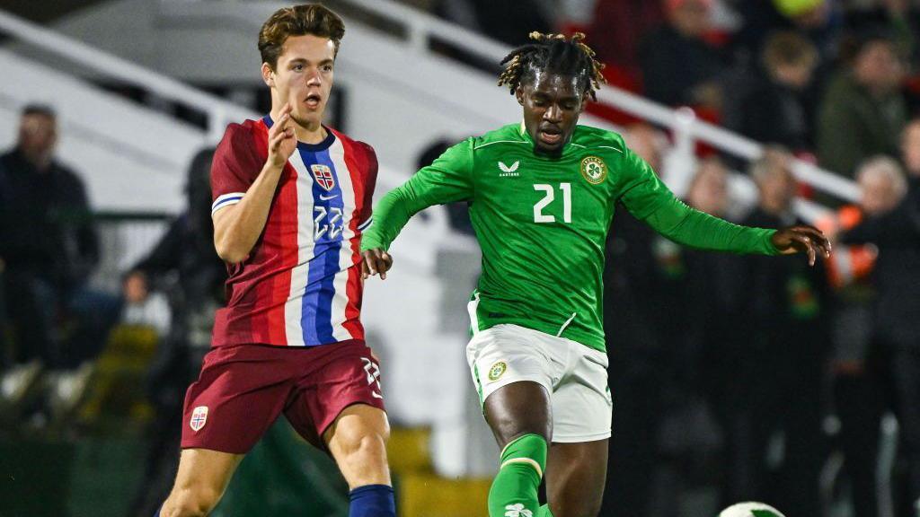 Sverre Nypan, pictured successful action for Norway Under-21s, battles pinch Baba Adeeko of Republic of Ireland
