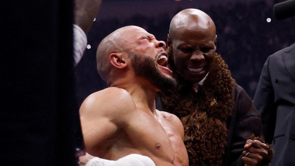 Eubank outpoints bitter rival Benn in emotional fight