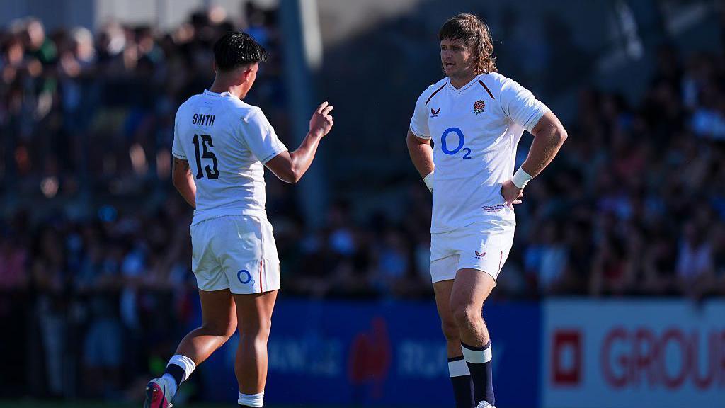 Benhard Janse van Rensburg talks to Marcus Smith while playing for an England XV
