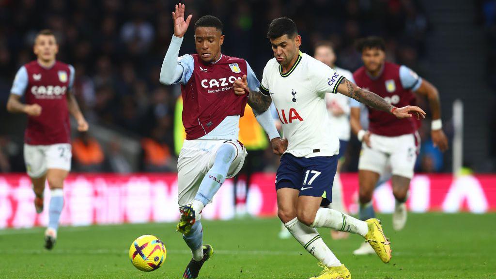 Cristian Romero of Tottenham Hotspur in action with Ezri Konsa of Aston Villa