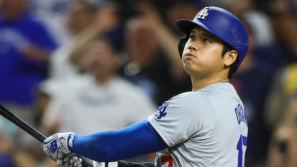 Shohei Ohtani watches the ball after hitting his historic 50th home run of 2024