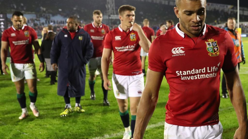 The Lions players come off the pitch at full-time