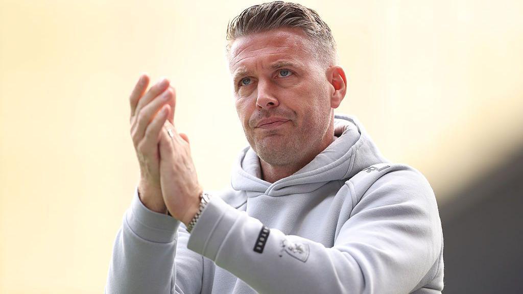 Rob Edwards claps the fans during a Middlesbrough game