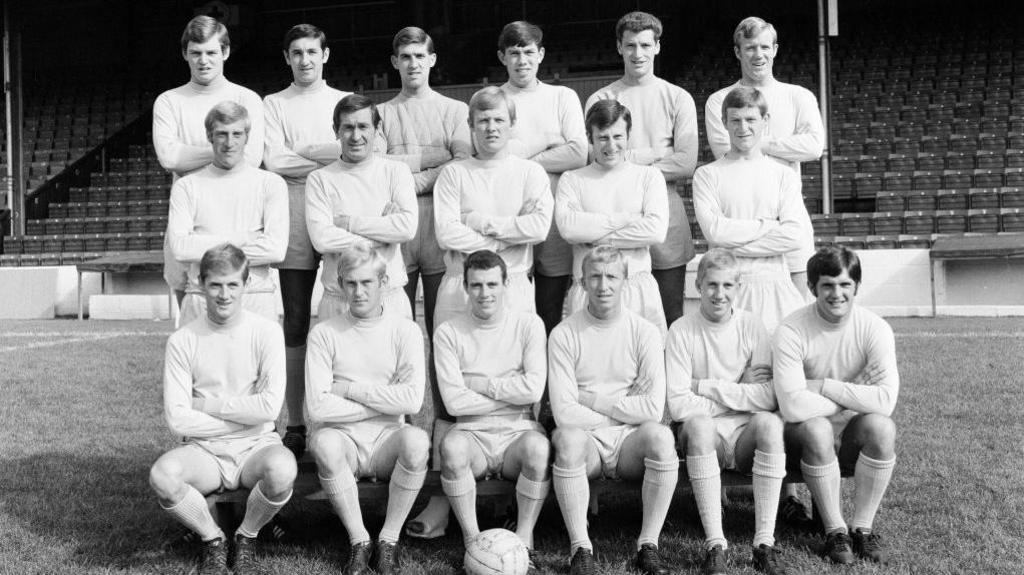 Reading FC's first team line-up at Elm Park in three rows in front of a seated stand 