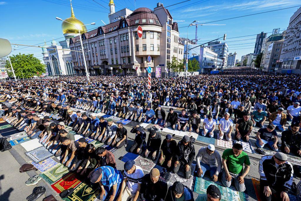 People performing Eid prayers outdoors in Moscow