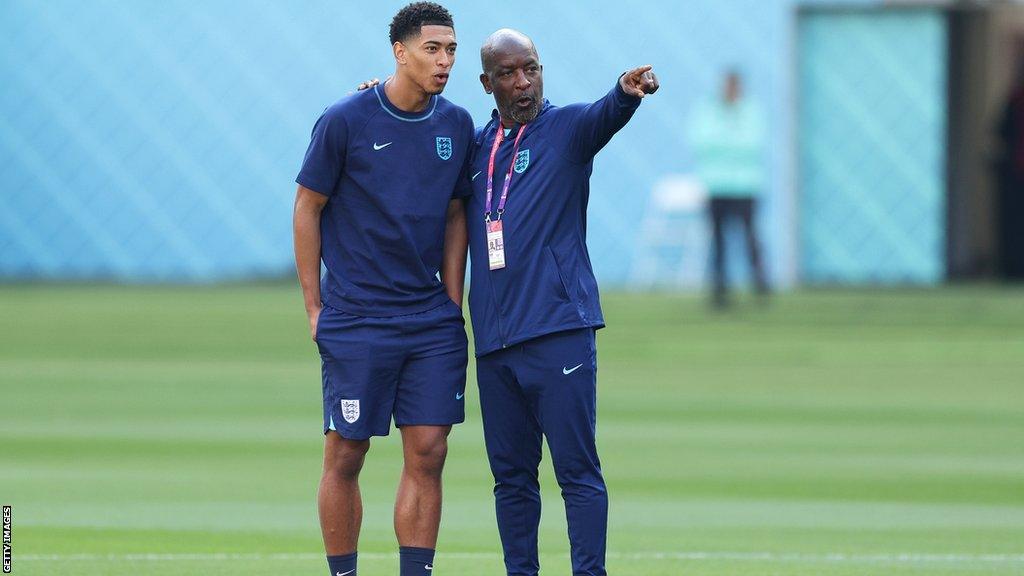 England coach Chris Powell (right) with player Jude Bellingham