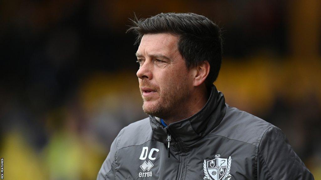 Darrell Clarke watches on from the touchline during a Port Vale game last season