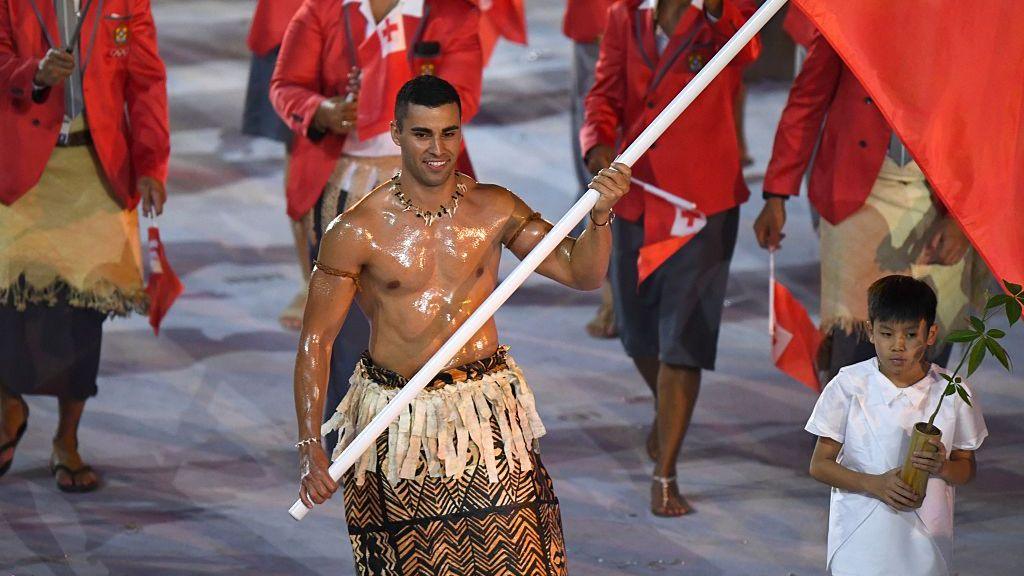 Tonga's flagbearer Pita Nikolas Taufatofua leads his delegation during the opening ceremony at Rio 2016