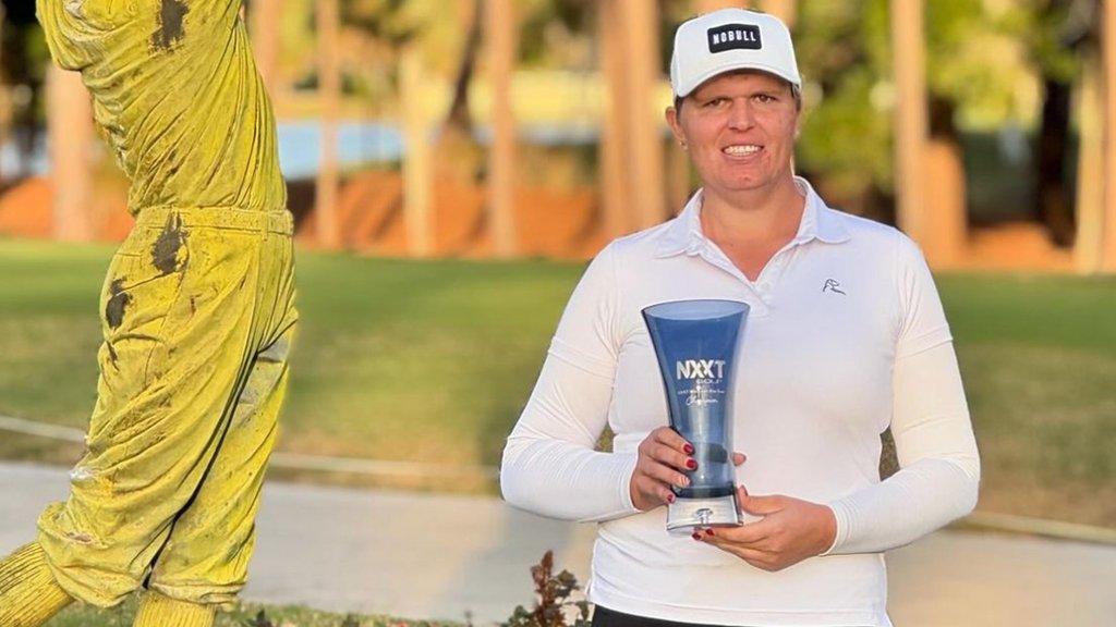 Hailey Davidson celebrates winning the NXXT Women's Classic in Orlando, Florida