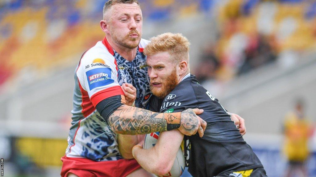 Leigh's Josh Charnley performs a tackle against York