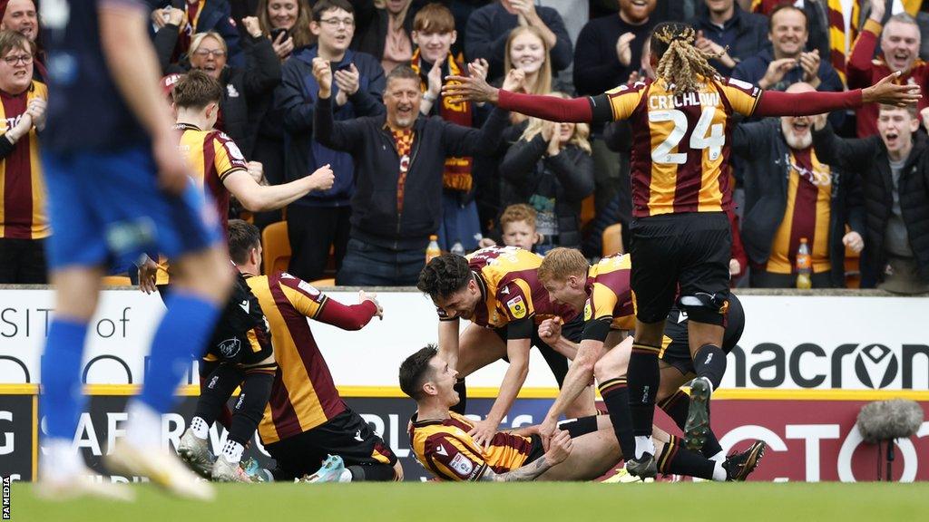 Jamie Walker celebrates his goal for Bradford