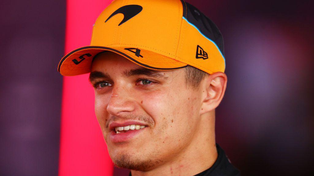 Close-up picture of Lando Norris wearing a McLaren cap