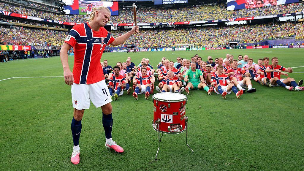Erling Haaland leads the Norway team in the 'Viking row' celebration following their 2-1 victory over Brazil.