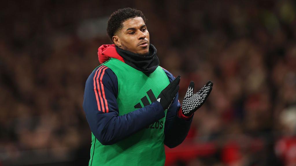 Marcus Rashford applauds the Man United fans