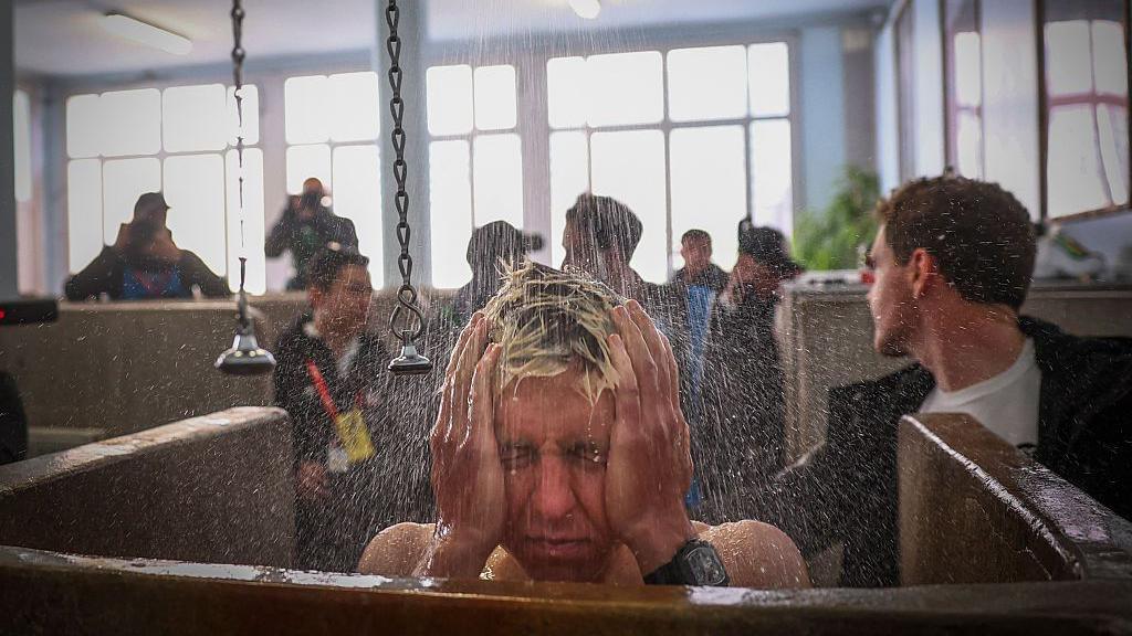 Tadej Pogacar showers after finishing second in Paris-Roubaix 2026