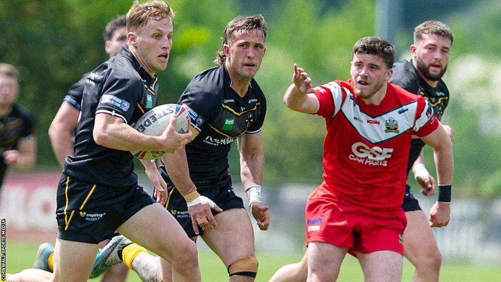 Cornwall RLFC player running with the ball