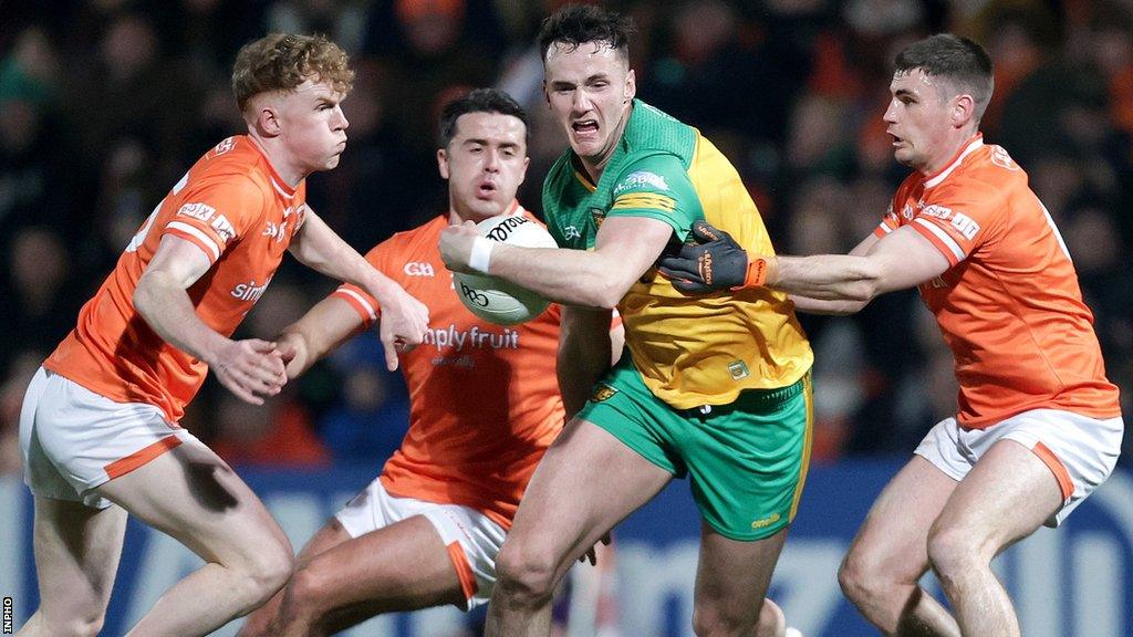 Donegal's Jason McGee attempts to get away from Armagh's Conor Turbitt, Stefan Campbell and Greg McCabe at the Athletic Grounds