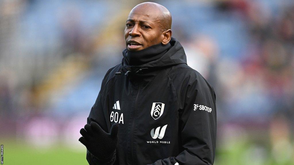 Luis Boa Morte in black and white training kit of Premier League side Fulham claps his hands