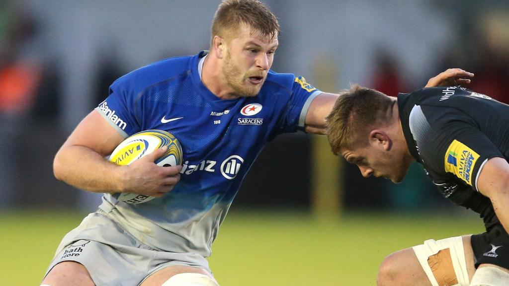 Saracens' George Kruis takes on Calum Green of Newcastle