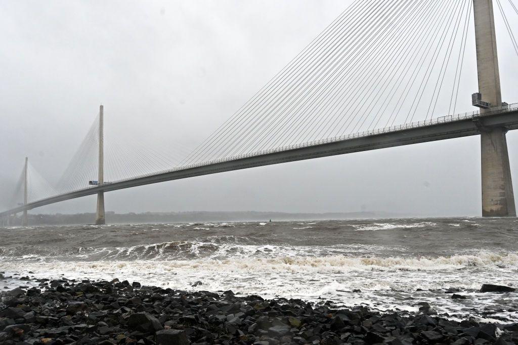 The Queensferry Crossing from Fife under very grey skies and with a broiling, grey Firth of Forth underneath.