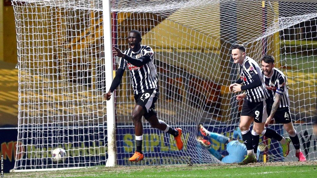 Notts County's Alassana Jatta celebrates his side scoring at Bradford