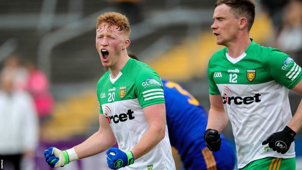 Oisin Gallen and Ciaran Thompson after the full-time whistle in Ennis