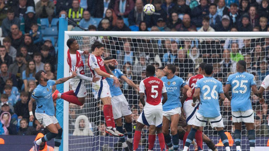 Arsenal score from a corner against Manchester City.