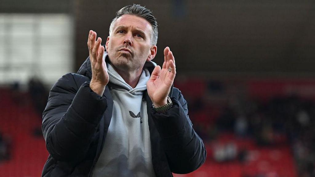 Rob Edwards claps the fans at Middlesbrough