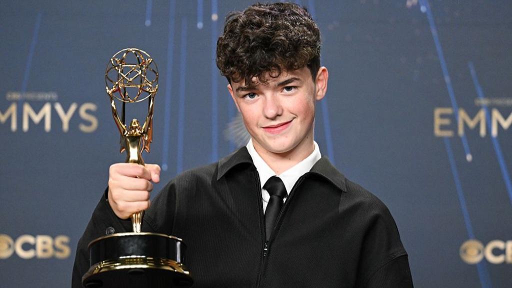 Owen Cooper poses with the Outstanding Supporting Actor