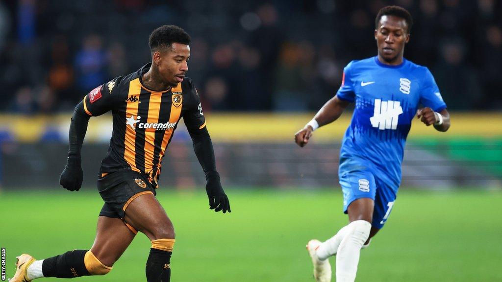 Hull City's Jason Lokilo dribbles past Birmingham City's Siriki Dembele during their FA Cup third round replay