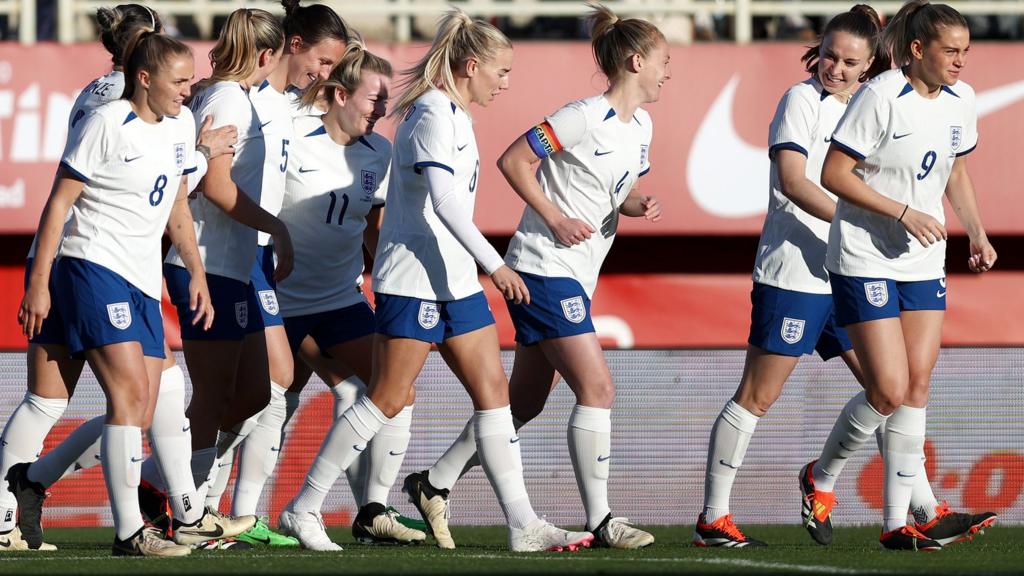 England players celebrate Lotte Wubben-Moy's opener