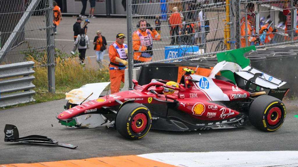 Ferrari's Lewis Hamilton sat in his damaged car after crashing out of the Dutch Grand Prix