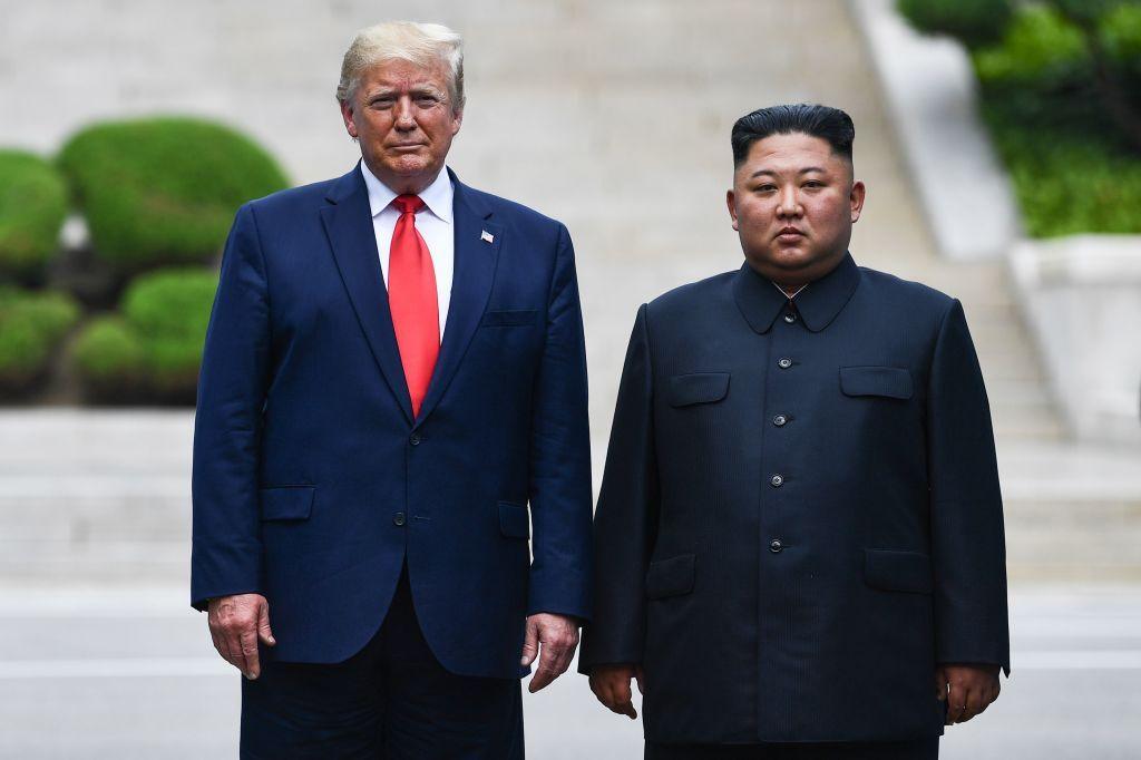 North Korea's leader Kim Jong Un poses with US President Donald Trump at the Military Demarcation Line that divides North and South Korea, in the Joint Security Area (JSA) of Panmunjom in the Demilitarized zone (DMZ) on June 30, 2019. 