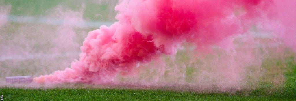 A pyrotechnic on a football pitch