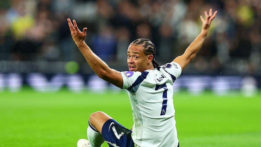Xavi Simons of Tottenham Hotspur reacts