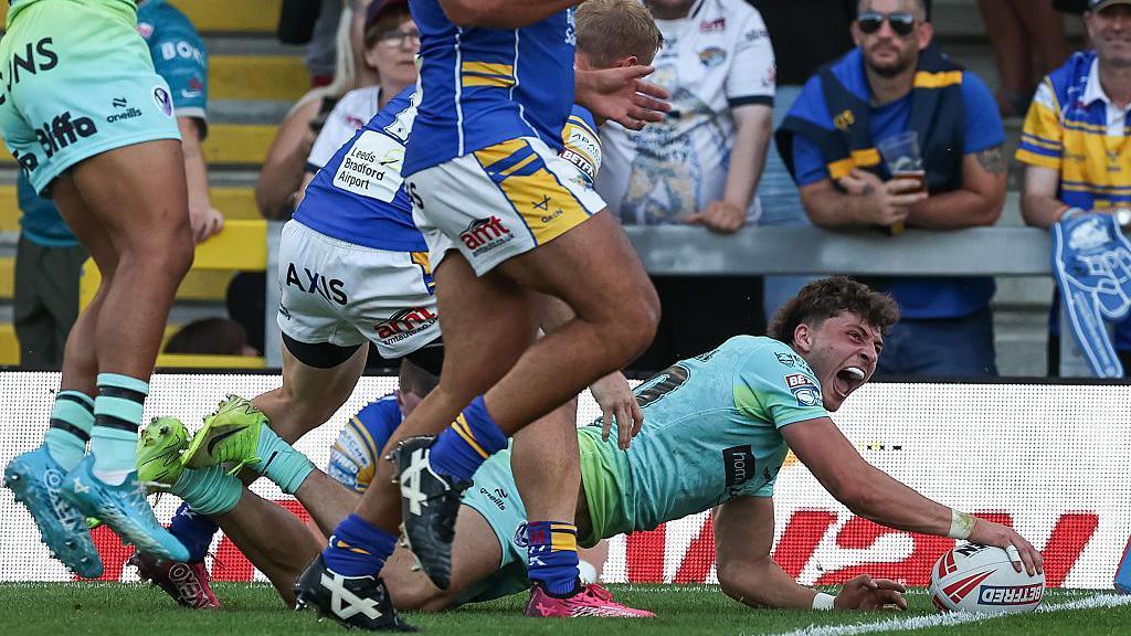 Owen Dagnall touching the ball on the try line