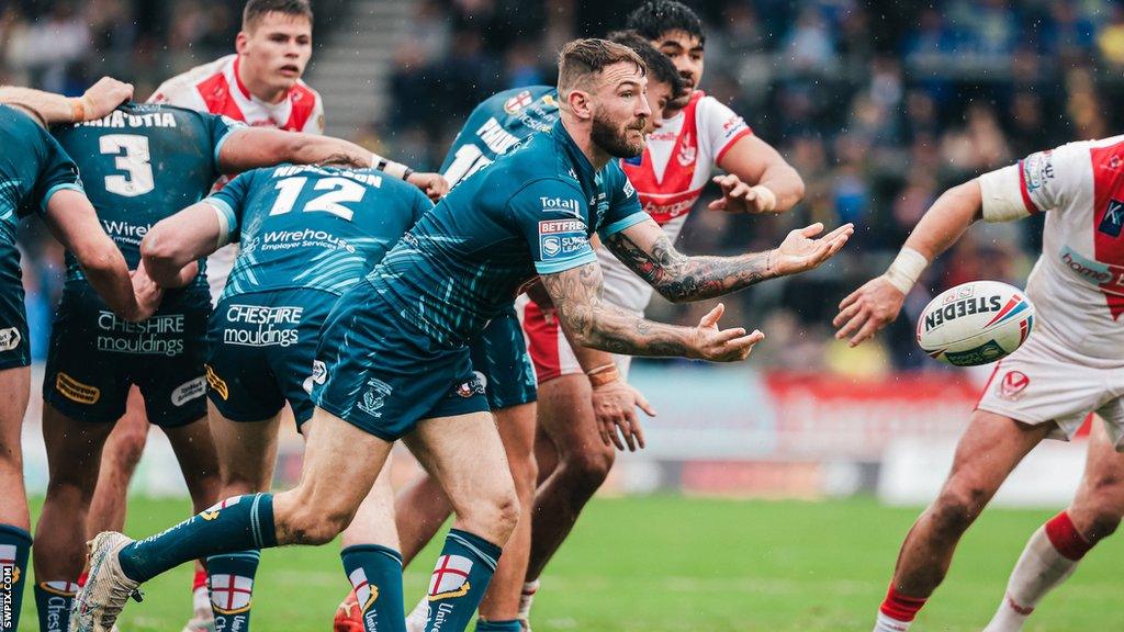 Daryl Clark chucks a pass for Warrington from a scrum