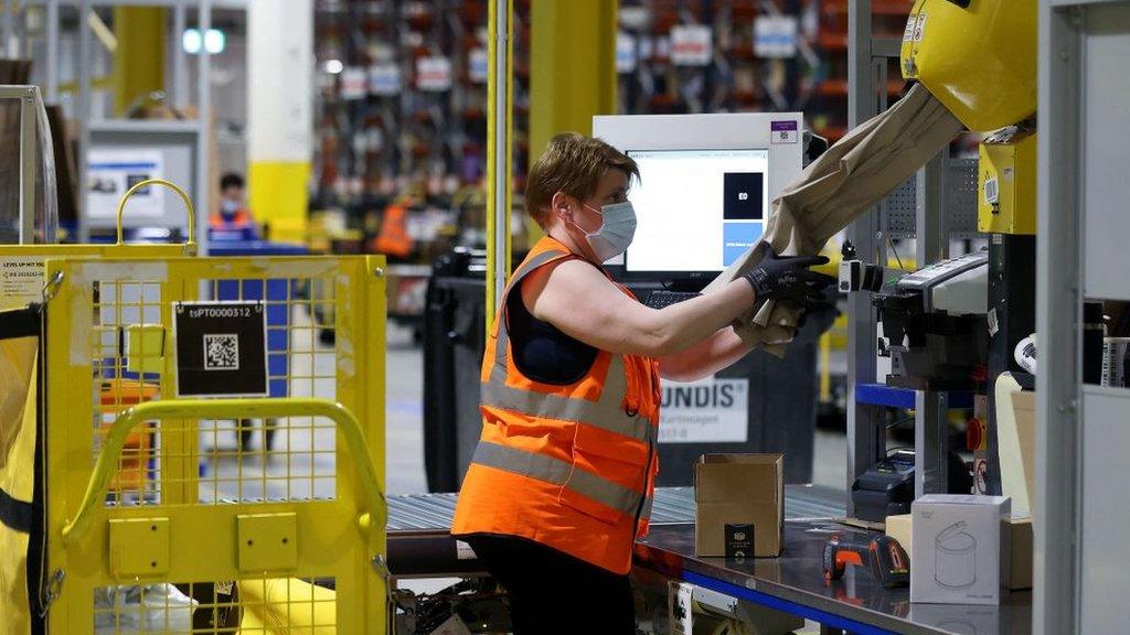 Worker in an Amazon warehouse.