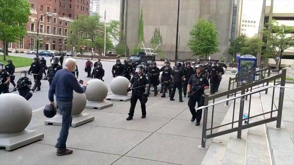 Elderly man approaches police