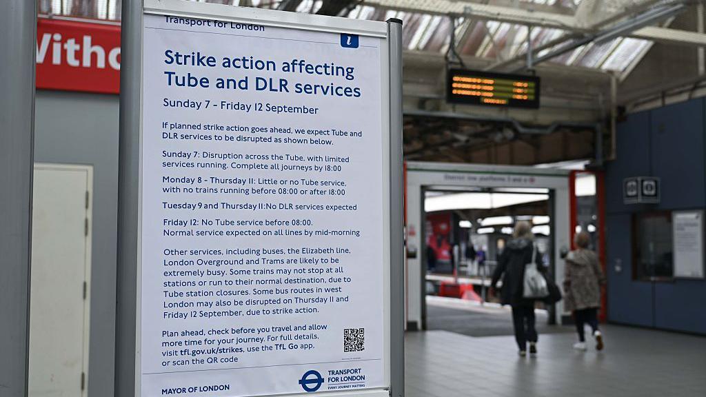 A notice board at a tube station with information on the strikes.