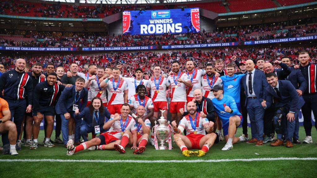 The full Hull KR squad on the pitch with the challenge cup 