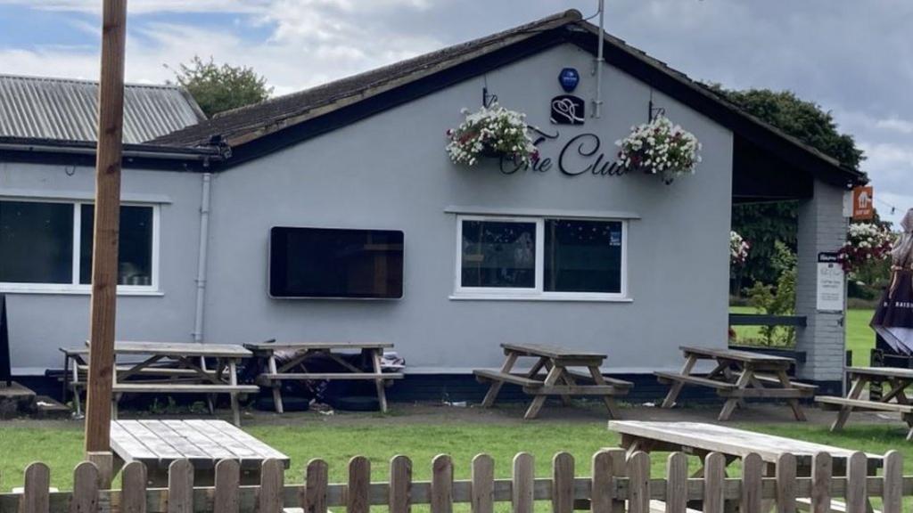 The Club at Tuffley Park, a social club with picnic benches out the front